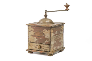 An antique coffee grinder or bean grinder. Vintage traditional manual coffee grinder on a white background.