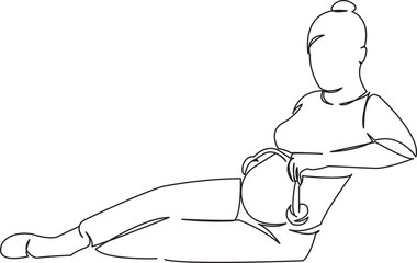 pregnant woman with headphones on her belly