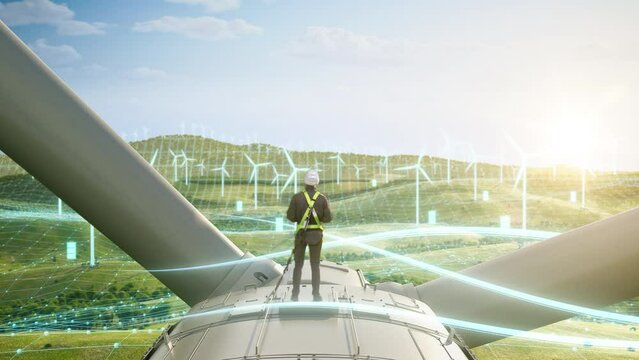 Caucasian Male Green Energy Engineer Using Laptop On Top Of Wind Turbine. Man Inspecting An Industrial Wind Farm. 3D Animated Visualization Of Sustainable Energy Being Generated. Zoom Out Backview.