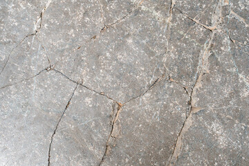 Background of paving tiles of natural rock. Image of cracked stone