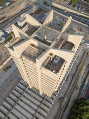 An old Abandoned Brutalist tower in the downtown of Haifa from a drone view 