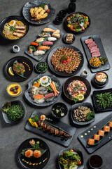 many traditional japanese food dishes variety on grey background in Tokyo restaurant - 625921113
