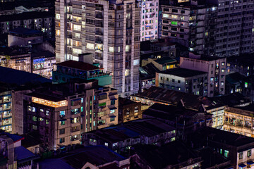 High angle view of illuminated buildings in city at night in Yangon downtown, Myanmar, Asia 