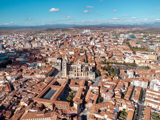 Aerial drone point of view of old town center of Leon. In the middle is the spectacular Cathedral of Leon. Historic city and important travel destination in Spain. Panoramic view of city center.