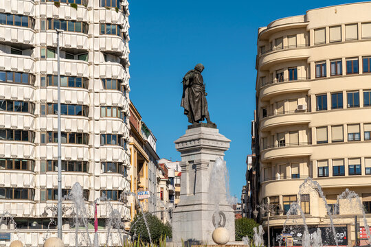 Leon, Spain - November 12 2022: View of Plaza Guzman El Bueno with the fountain and Monument to Guzm&aacute;n el Bueno, in the city center of Leon. 