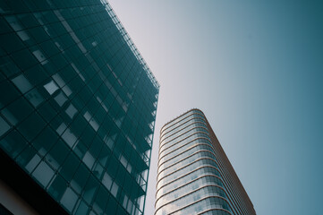 Contemporary residential buildings exterior in the daylight. Modern European residential apartment buildings quarter on a sunny day. Skyscrapers against blue sky, bottom view. 