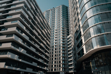 Contemporary residential buildings exterior in the daylight. Modern European residential apartment buildings quarter on a sunny day. Skyscrapers, bottom view