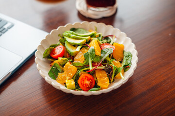 Mixed Salad with Fruit and Avocado on the table