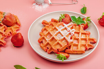 Homemade Belgian Waffles with strawberries. Gluten-free red dessert, fresh fruits and basil