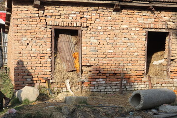 village buildings made up of brick, buildings used as barns for the storage of old unused things, Background of brick wall texture, ruined old brick house