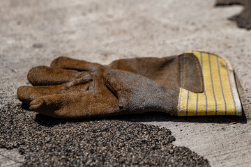 a work glove on a street