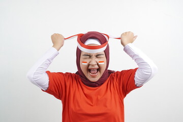 Women celebrate independence day by wearing red and white ribbon