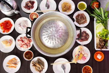 Chonburi Thailand - April 8 2023 : Thai food style. shabu sukiyaki or Moo-Ka-Ta griiled pork.