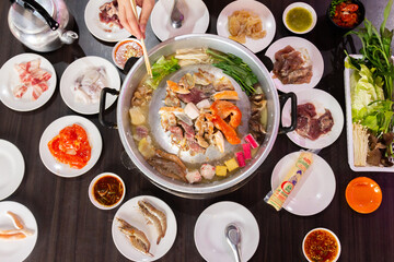 Chonburi Thailand - April 8 2023 : Thai food style. shabu sukiyaki or Moo-Ka-Ta griiled pork. - obrazy, fototapety, plakaty