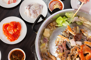 Thai food style. shabu sukiyaki or Moo-Ka-Ta griiled pork.