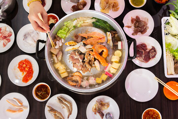 Thai food style. shabu sukiyaki or Moo-Ka-Ta griiled pork.