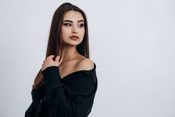 Naklejka premium Close up fashion portrait of young pretty indian latin american woman posing in photo studio on white background. Hispanic lady, skin care, solarium, make up, cosmetology 