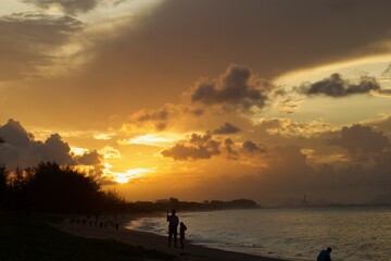 Fototapeta na wymiar The morning walk at the beach with a beautiful sunrise .