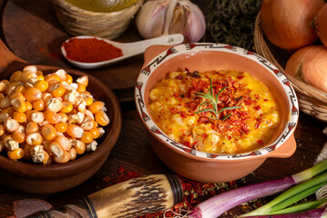 bowl with typical latin american food locro with vegetables and corn on a wooden table - obrazy, fototapety, plakaty