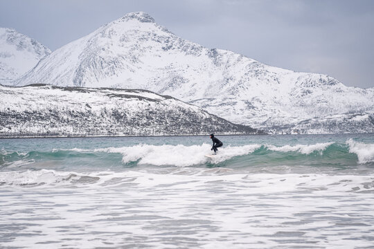 Arctic Surfing In Winter In The Lofoten