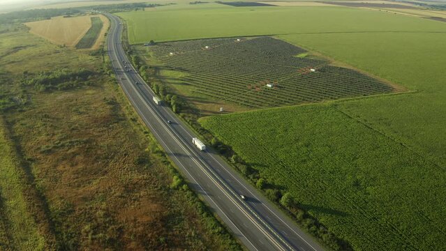 Highway roads of Romania. 4K aerial video with A2 motorway road from Bucharest to Constanta during a beautiful summer sunrise. High speed infrastructure industry.