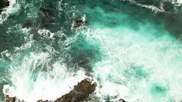 Coastal water. Waves hitting rocks. Turquoise water