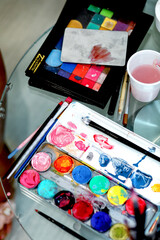 palette with paints and brushes