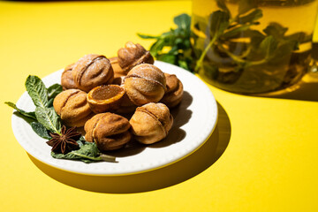 Homemade nut cookies with condensed milk on a yellow background