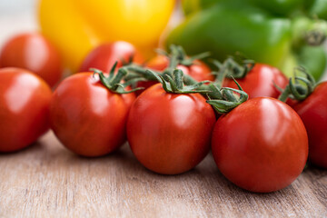 fresh summer cherry tomatoes on a branch