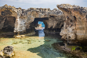 The amazing natural pools of Marina Serra, in Puglia, Salento, Tricase. The clear and crystalline turquoise sea, between the rocky cliff. The blue sky, in the summer.