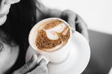 aromatic morning coffee in female hands
