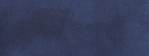 Fototapeta na wymiar Texture of velvet matte navy blue background, macro. Suede denim fabric with pattern. Seamless textile felt backdrop