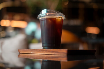 A glass of Black coffee in modern coffee shop
