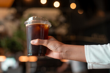 A glass of Black coffee in modern coffee shop