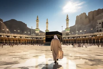 Fotobehang Man in pilgrim performing haj or umrah in front of kaaba, Mecca  © Rekalawa