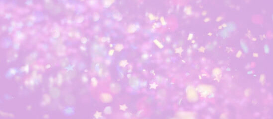 Colorful confetti festival on purple background with blurry elements.