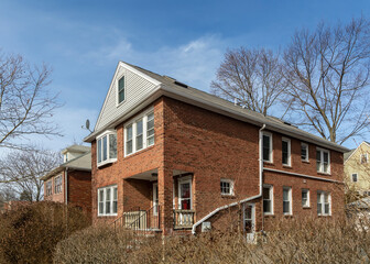 Fototapeta na wymiar Renovated old brick two story house, Brighton, Massachusetts, USA