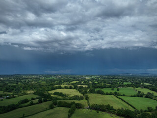 rain showers over green countryside