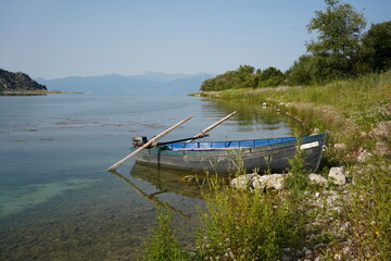 Beautiful scene with a fisherboar at lake prespa. 