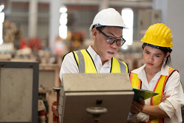 two professional engineer,worker,technician use clipboard discuss work, walk in steel metal...