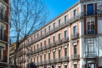 Fototapeta na wymiar Luxury old residential buildings in Serrano Street in Salamanca neighborhood in central Madrid