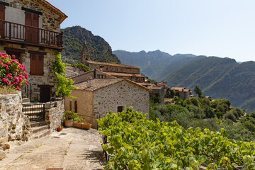 Beautiful village in the mountains with medieval stone houses in south of France