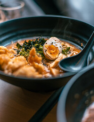 Steamy ramen bowl with egg and meat