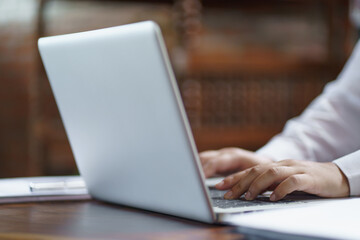 Happy young Asian Woman working on computer Business Data Analyst.