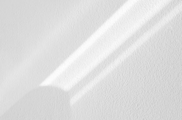White wall concrete texture with abstract drop diagonal shadow. Sunlight overlay on white plaster paint on concrete floor,Light effect for Monochrome photo,mock up,poster, wall art,design presentation