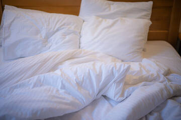 Fototapeta na wymiar unmade bed after sleep, wrinkled bed linen
