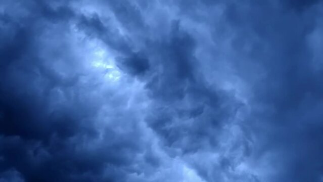 Tornado wind storm whirling clouds abstract blue background energy
