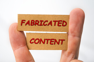Misleading and fabricated content sign on a white