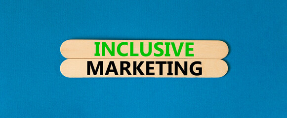 Inclusive marketing symbol. Concept words Inclusive marketing on beautiful wooden stick. Beautiful blue table blue background. Business inclusive marketing concept. Copy space.