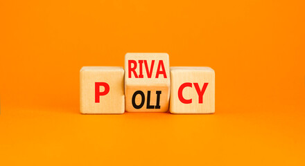 Privacy policy symbol. Concept words Privacy policy on wooden block on a beautiful orange table orange background. Business and privacy policy concept. Copy space.